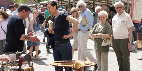 Antique market at Ostbahnhof in Berlin People at antique market Ostbahnhof in Berlin