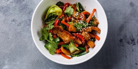 Dish with vegetables, coriander and sesame seeds  Dish with vegetables, coriander and sesame seeds