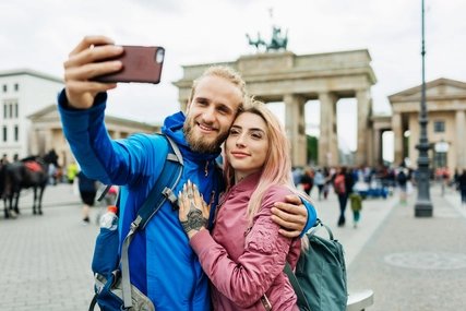 Selfie in front of the Brandenburg Gate Stylish Young Couple Take A Selfie In Front Of Local Architecture