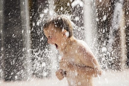 Child playing in fountain Water fountain