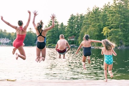 Children jumping into a lake Children jumping into a lake