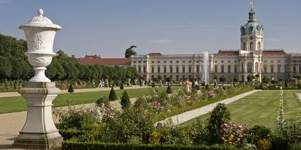 Park of Charlottenburg Palace  Walkers in the summery park of Charlottenburg Palace