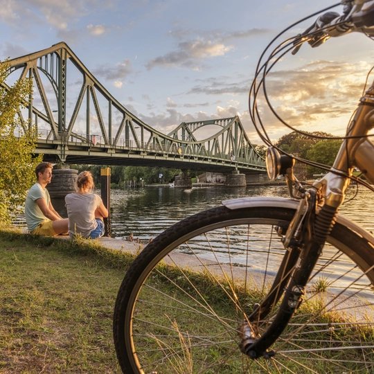 Riding by bike at Glienicker Brücke Riding by bike at Glienicker Brücke