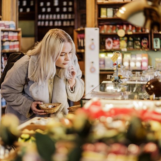 Christmas shopping at the Winterfeldt Schokoladen shop in Berlin A young woman Christmas shopping at the Winterfeldt Schokoladen shop in Berlin
