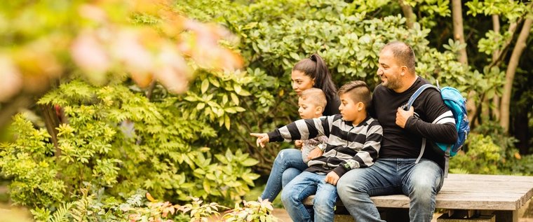 Travelling to Berlin with children Family sitting in the park