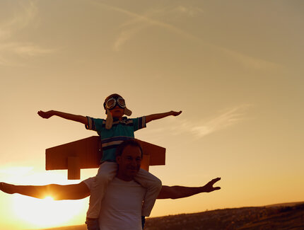Father and son  at sunset in natur
