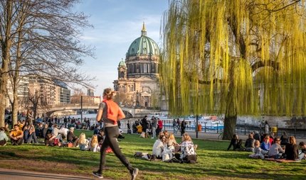 Jogging by the Berlin Cathedral in spring Jogging by the Berlin Cathedral in spring