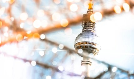 Berlin Tv-tower behind golden shining Christmas lights Berlin Tv-tower behind golden shining Christmas lights