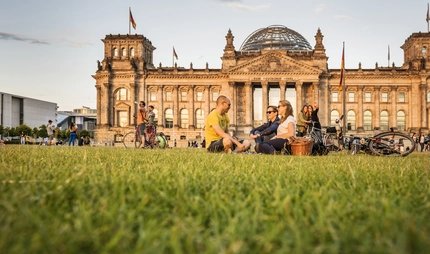 Reichstag in Berlin Picnic at the Berlin Reichstag in the light of the evening sun