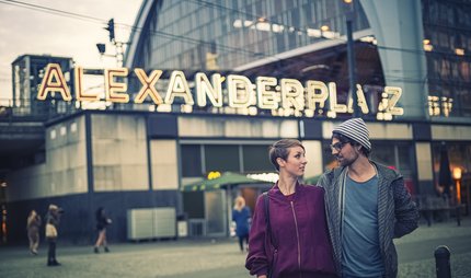S-Bahn station Alexanderplatz Young couple in front of the Alexanderplatz S-Bahn station at dusk