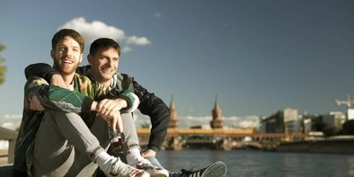 Gay couple at the Oberbaumbrücke  Gay couple at the Oberbaumbrücke in Berlin-Friedrichshain