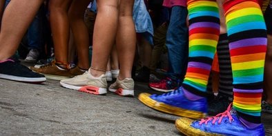 Rainbow socks in Berlin Person with rainbow socks in crowd in Berlin